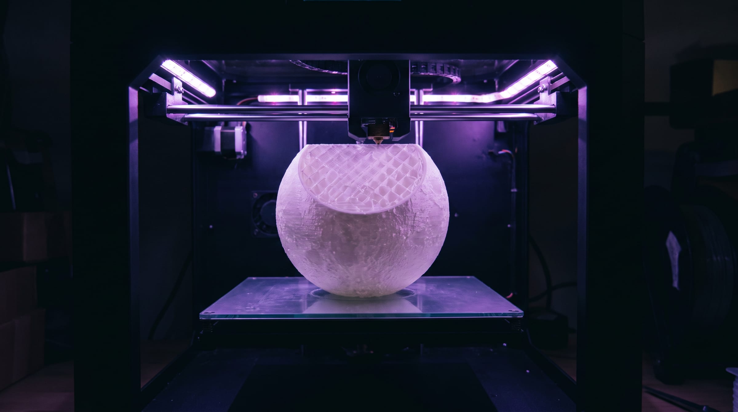 A lamp shell being printed layer by layer inside one of our printers