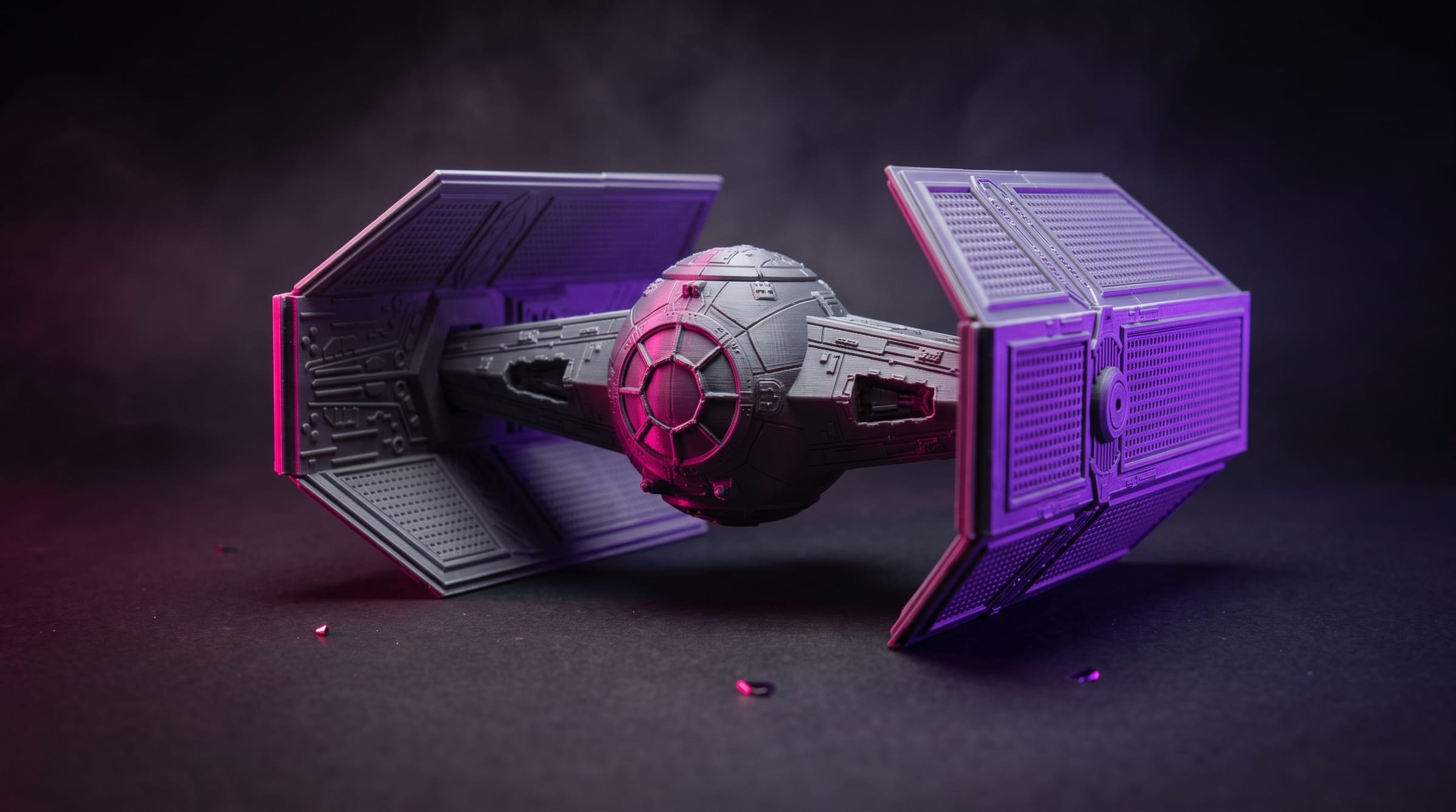 The Star Wars Titan Fighter model lit with pink and violet light